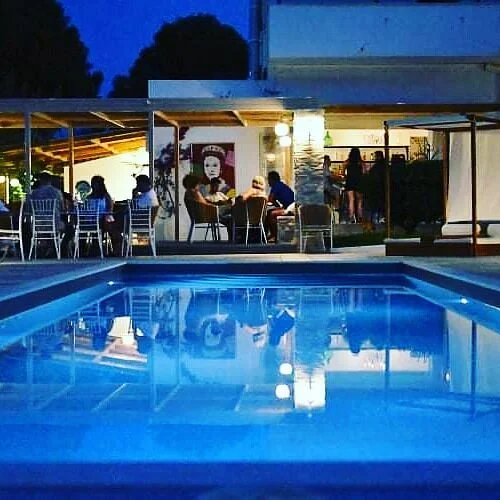 Outdoor seating at Crazy Rooster restaurant and cocktail bar in Kolios, Skiathos